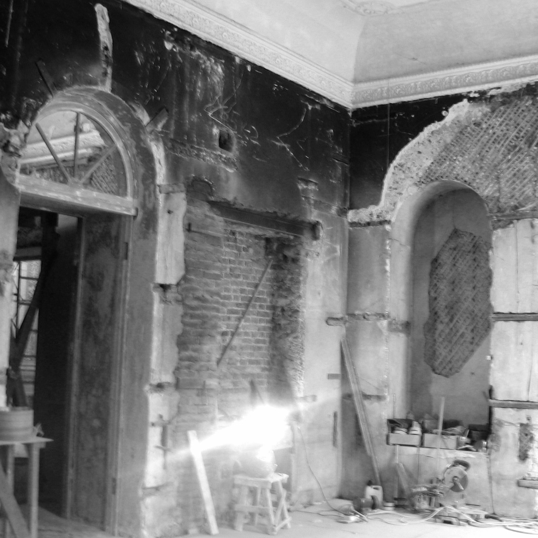 Dilapidated interior undergoing restoration work.