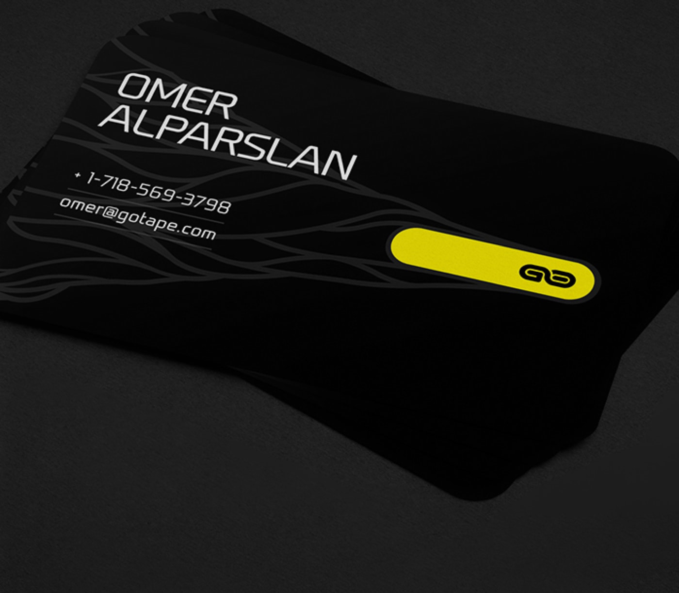 Black business card with yellow accent