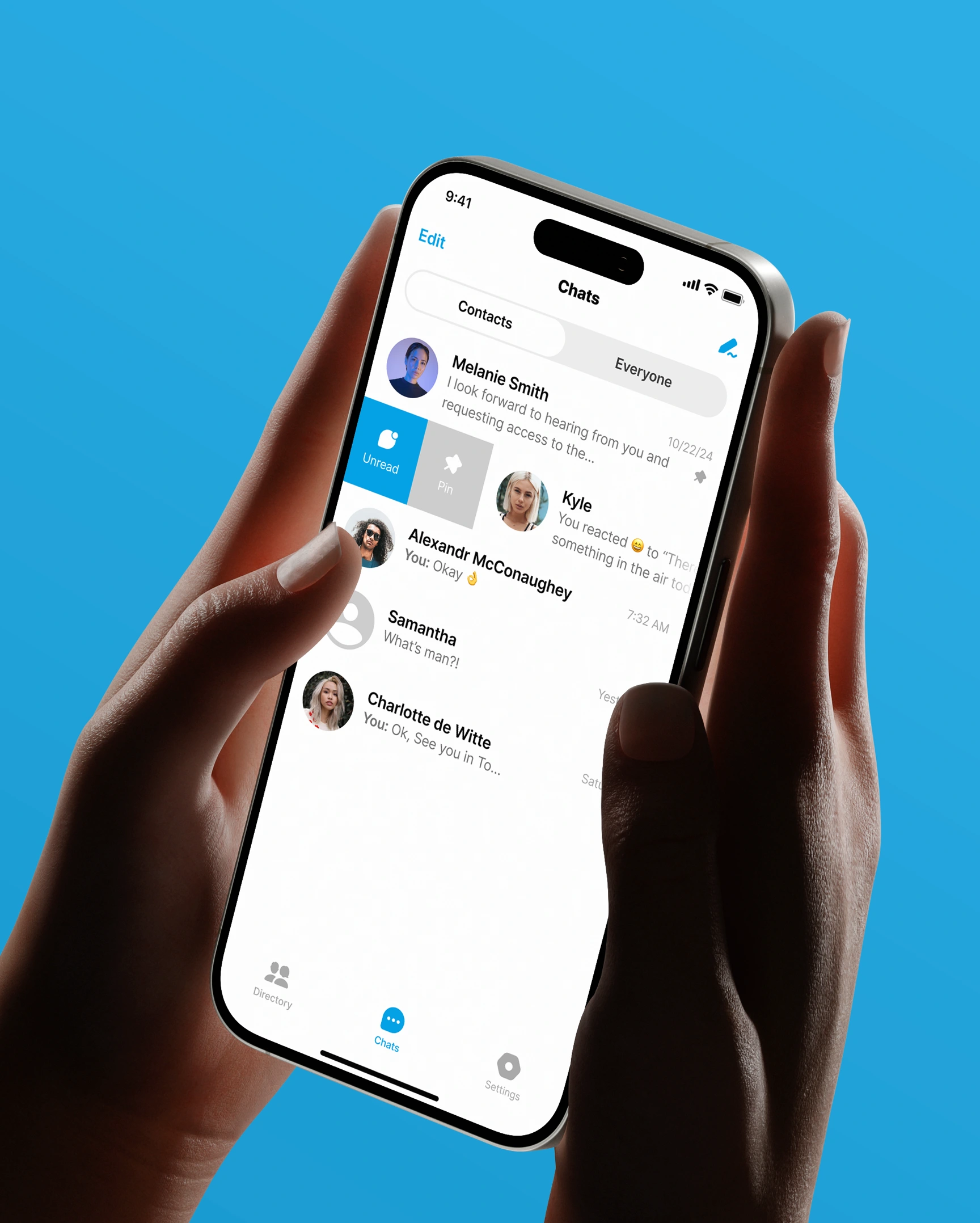 Hand holding smartphone displaying chat app